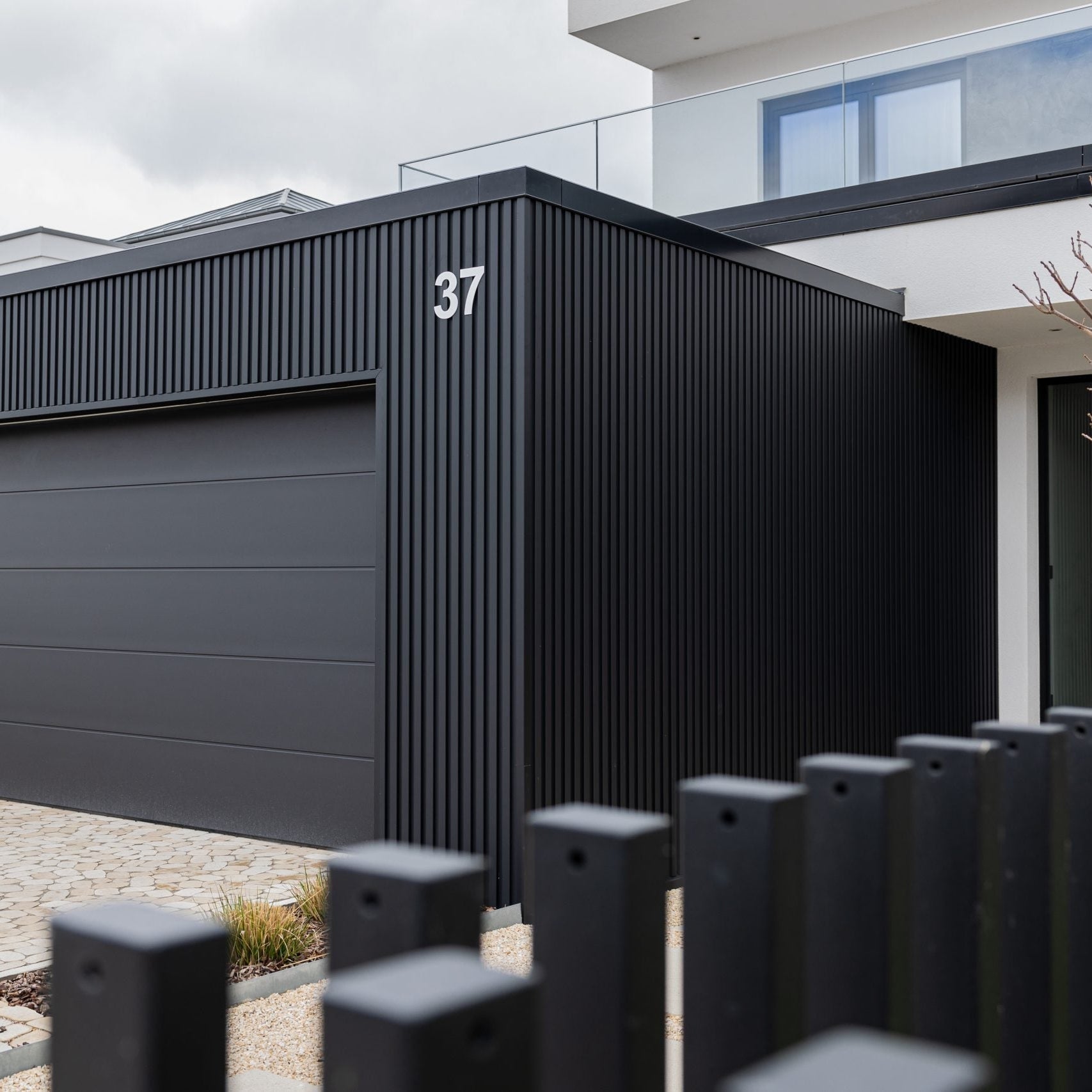 Leo Main AluWood exterior wood slat panels on modern home